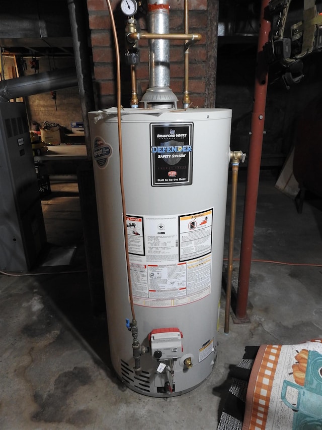 utility room featuring water heater