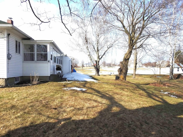 view of yard with a sunroom