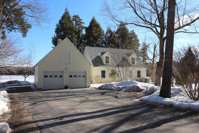 cape cod house with driveway