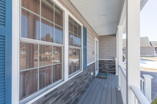 wooden terrace with a porch