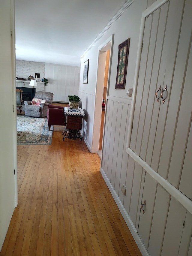 hall with hardwood / wood-style floors