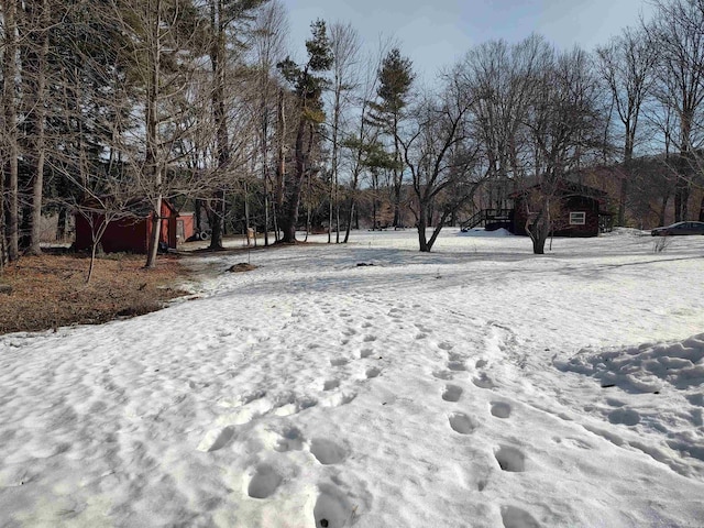 view of yard layered in snow