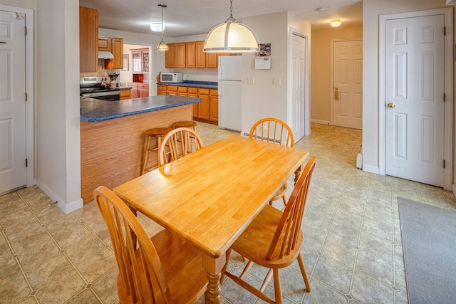 dining room with baseboards