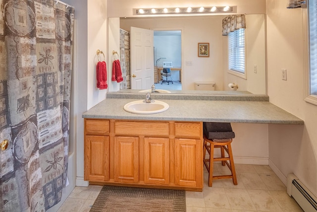 bathroom with tile patterned flooring, baseboard heating, vanity, and a shower with curtain