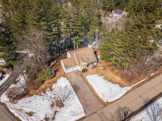 birds eye view of property with a wooded view