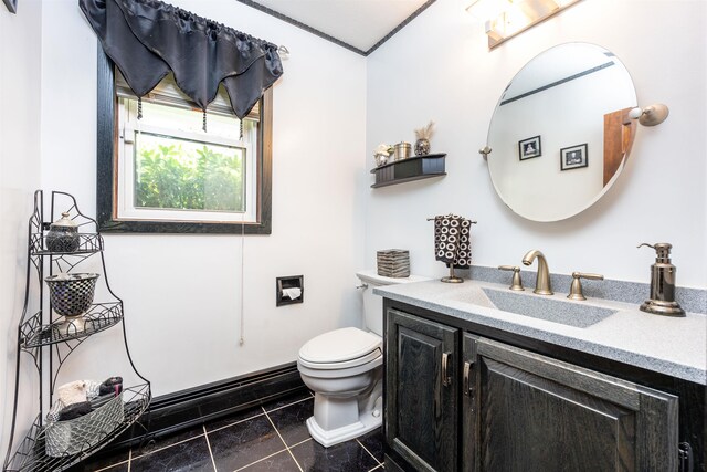 half bathroom with vanity and toilet