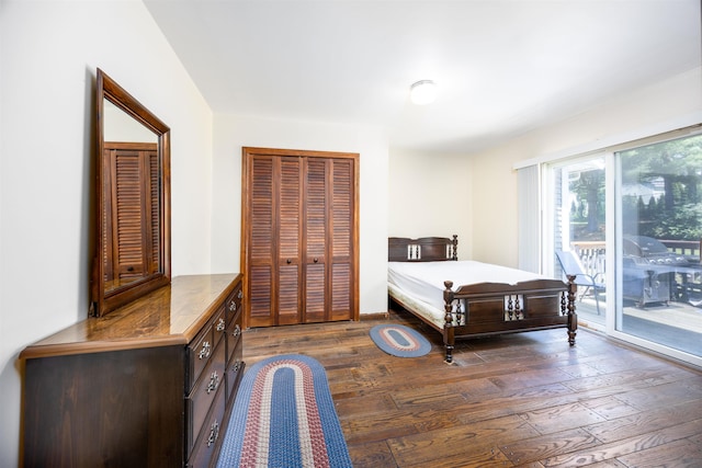 bedroom with access to exterior, dark wood finished floors, and a closet