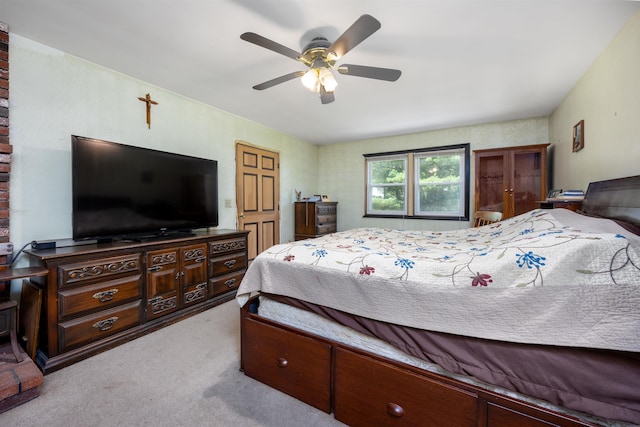 bedroom with a ceiling fan and carpet floors