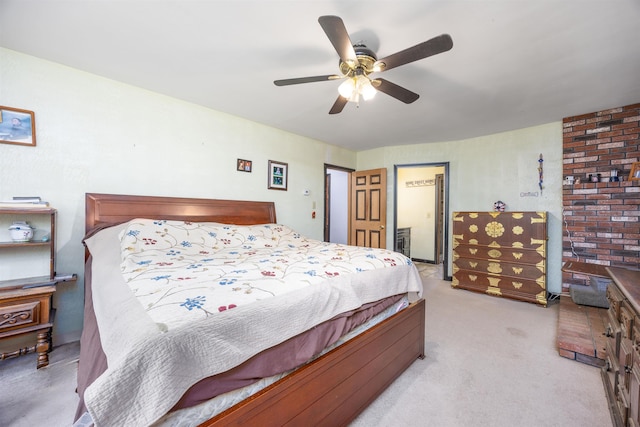 bedroom featuring light colored carpet and ceiling fan