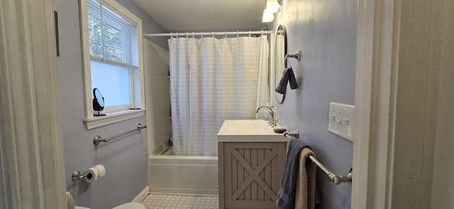 full bathroom featuring toilet, shower / bath combo, and vanity