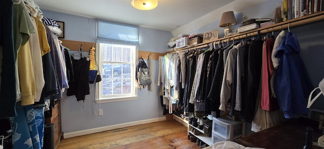 spacious closet featuring hardwood / wood-style flooring and visible vents