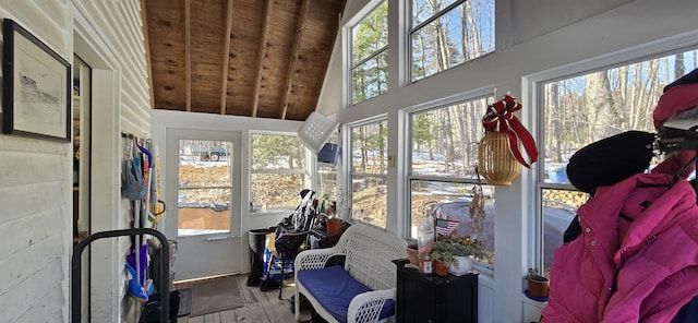 sunroom featuring lofted ceiling