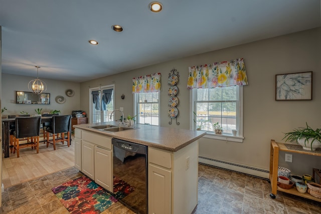 kitchen with an inviting chandelier, recessed lighting, a sink, black dishwasher, and baseboard heating