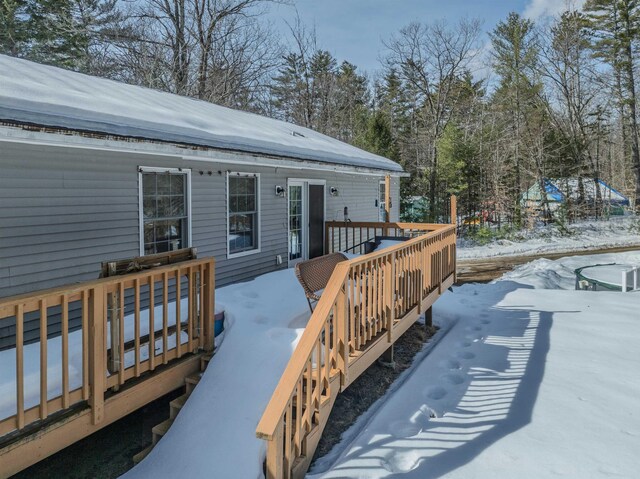 view of snow covered deck