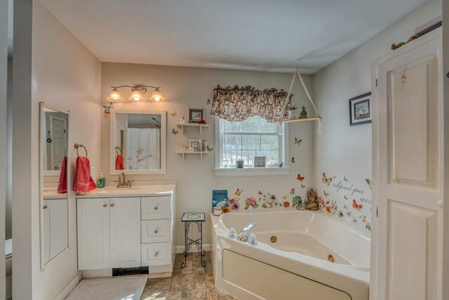 full bathroom with toilet, vanity, and a whirlpool tub