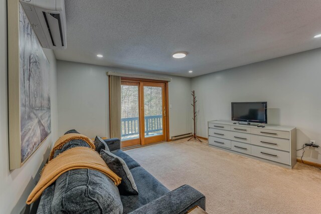 living area with baseboards, recessed lighting, a textured ceiling, light colored carpet, and baseboard heating