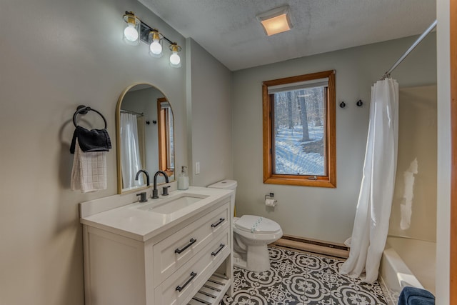 bathroom featuring vanity, a textured ceiling, tile patterned floors, toilet, and baseboard heating