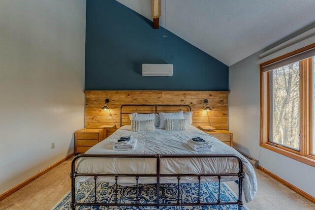 carpeted bedroom featuring baseboards, lofted ceiling, and a wall unit AC