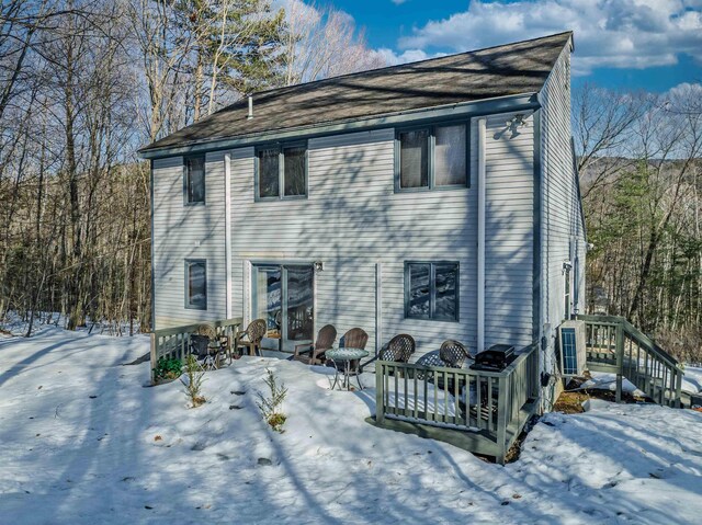 view of snow covered house