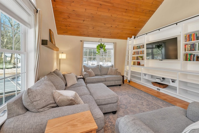 living area with wooden ceiling, built in shelves, wood finished floors, and lofted ceiling