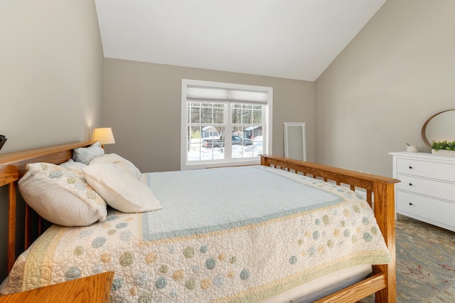 bedroom featuring lofted ceiling