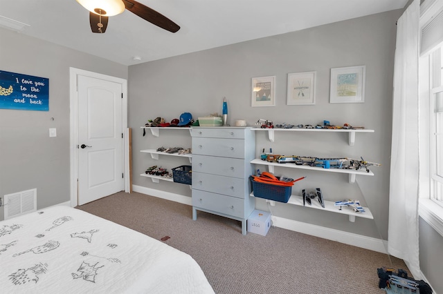 bedroom with visible vents, baseboards, carpet, and ceiling fan