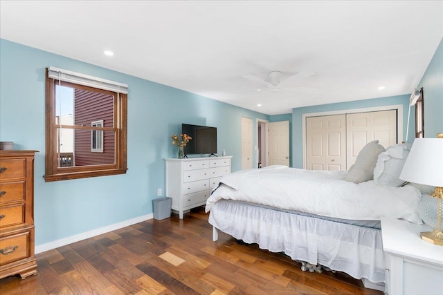 bedroom with a ceiling fan, wood finished floors, recessed lighting, a closet, and baseboards