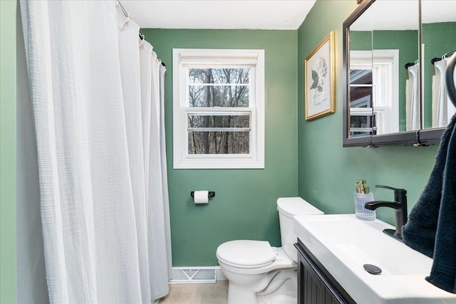 full bathroom with vanity, baseboards, tile patterned flooring, curtained shower, and toilet