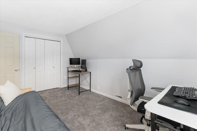 home office featuring visible vents, baseboards, lofted ceiling, and carpet