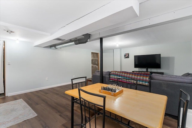 dining area with visible vents, baseboards, and wood finished floors