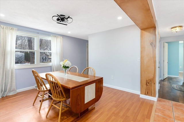 dining space with recessed lighting, baseboards, and light wood finished floors