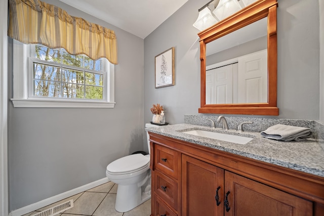 bathroom with visible vents, baseboards, toilet, tile patterned floors, and vanity