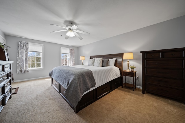 bedroom with baseboards, light carpet, and ceiling fan