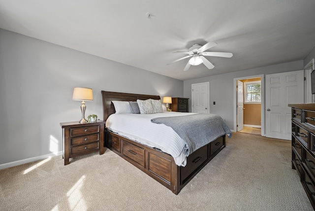 bedroom featuring baseboards, light carpet, and ceiling fan