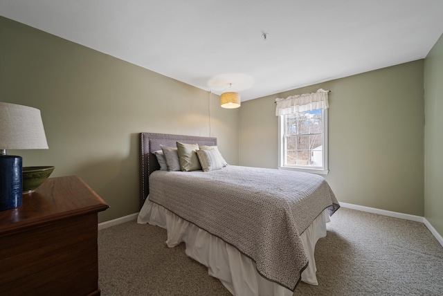 bedroom with carpet and baseboards