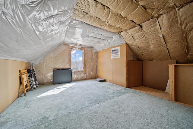 bonus room featuring carpet flooring and vaulted ceiling