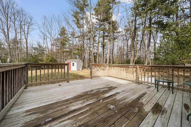 deck featuring a storage unit and an outdoor structure