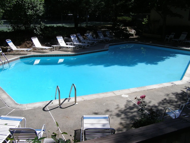 pool with a patio