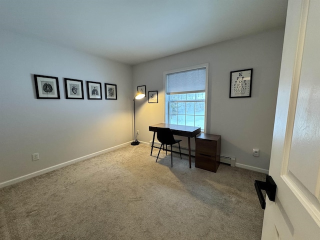 carpeted office space with baseboard heating and baseboards