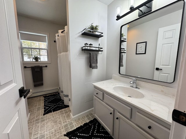 bathroom with a shower with curtain, baseboards, baseboard heating, and vanity