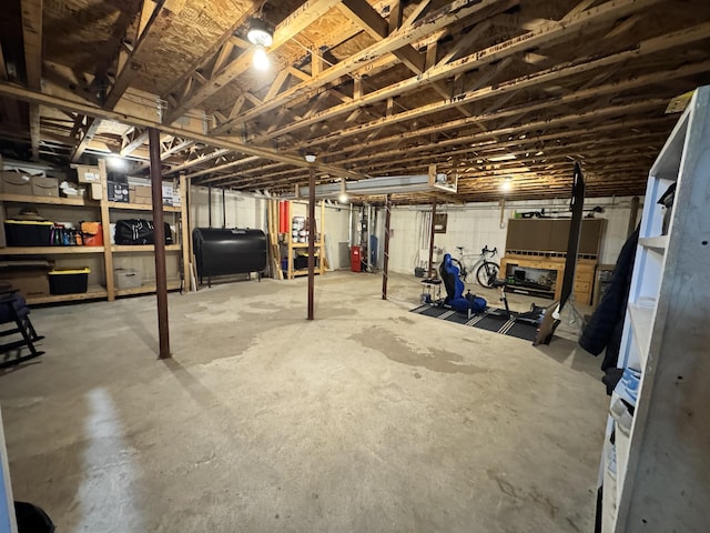 unfinished basement featuring heating fuel