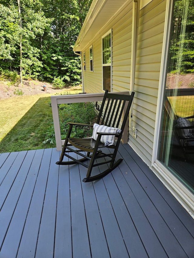 deck featuring a lawn