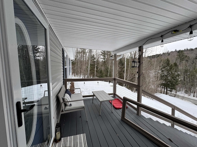 view of snow covered deck