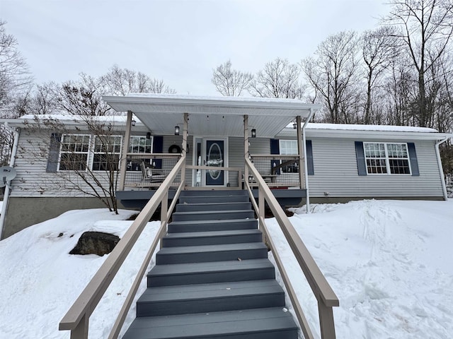 view of front of house featuring stairs and covered porch