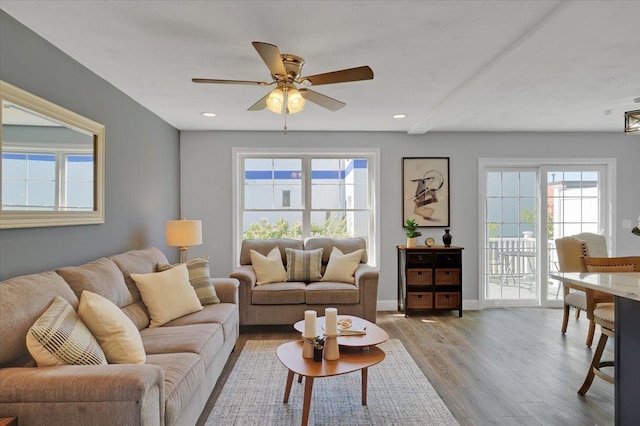 living area with recessed lighting, baseboards, wood finished floors, and a ceiling fan