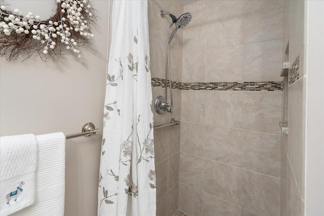 bathroom with a tile shower