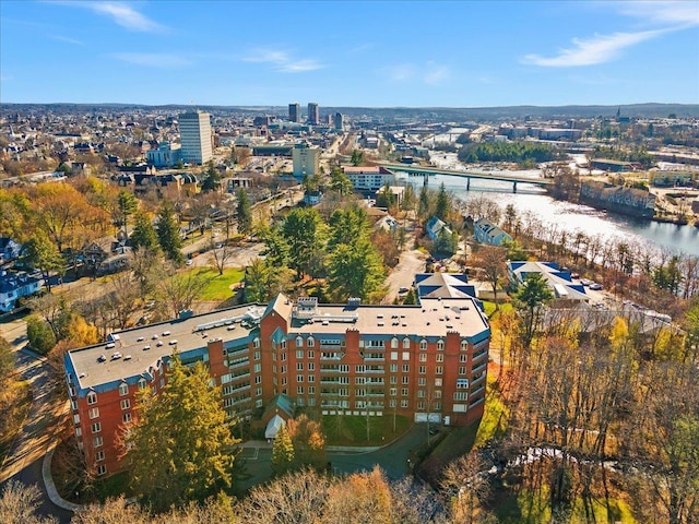 birds eye view of property with a water view and a city view