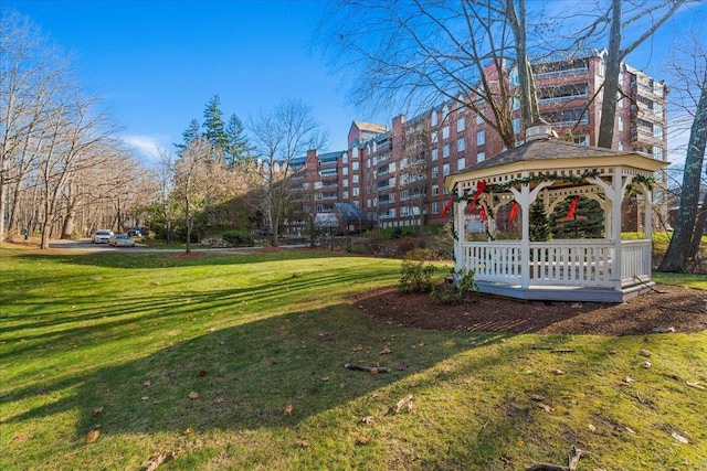 view of property's community with a gazebo and a lawn