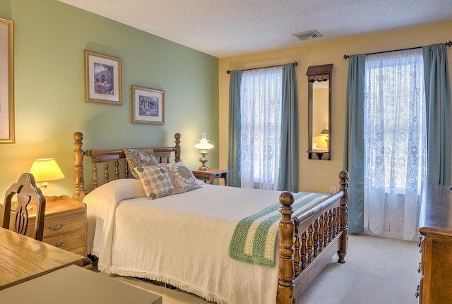 bedroom featuring carpet and visible vents