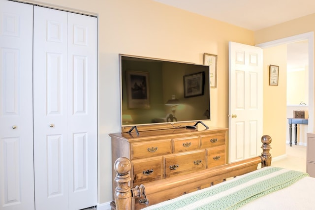 bedroom featuring a closet and baseboards